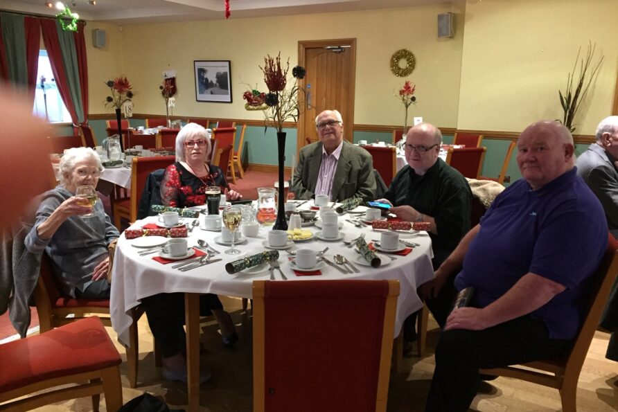 group of people having a Christmas lunch