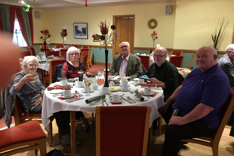 group of people having a Christmas lunch