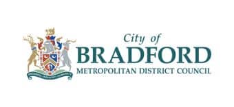 The City of Bradford Metropolitan District Council logo, featuring a detailed coat of arms with two deer and a shield, next to the council’s name in green and blue text on a white background.