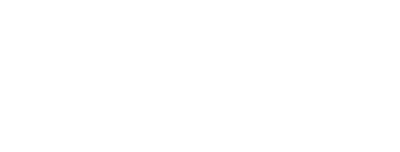 White logo with a house, tree, and cyclist on a path above a stone wall, next to the text VILLAGE GREEN in bold capital letters on a black background.