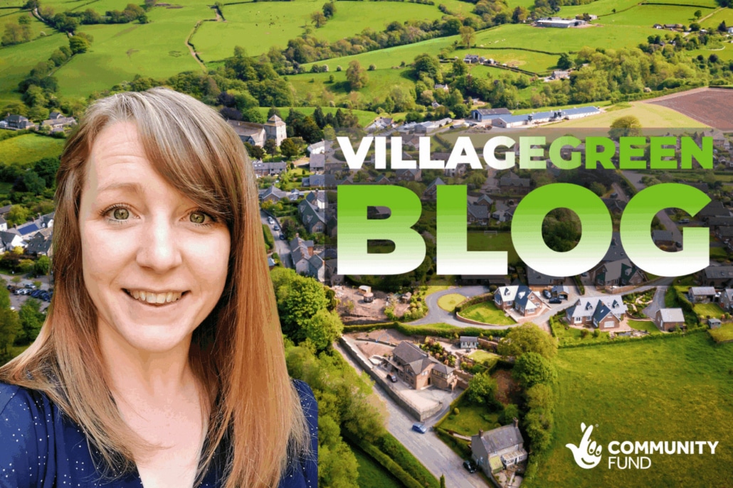 A smiling woman stands in front of an aerial view of a greener North Yorkshire village landscape. Large text reads VILLAGE GREEN BLOG and a Community Fund logo appears in the bottom right corner.