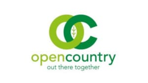 Logo with two overlapping green circles containing a leaf, forming the letters OC for Open Country. Below, "opencountry" appears in green and "out there together" in light green—perfect for a fundraising officer role in Harrogate.