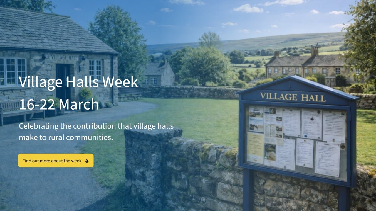 A countryside village hall with a noticeboard in front, surrounded by stone buildings and green grass. Text reads: Village Halls Week 16-22 March. Celebrating the contribution that village halls make to rural communities.