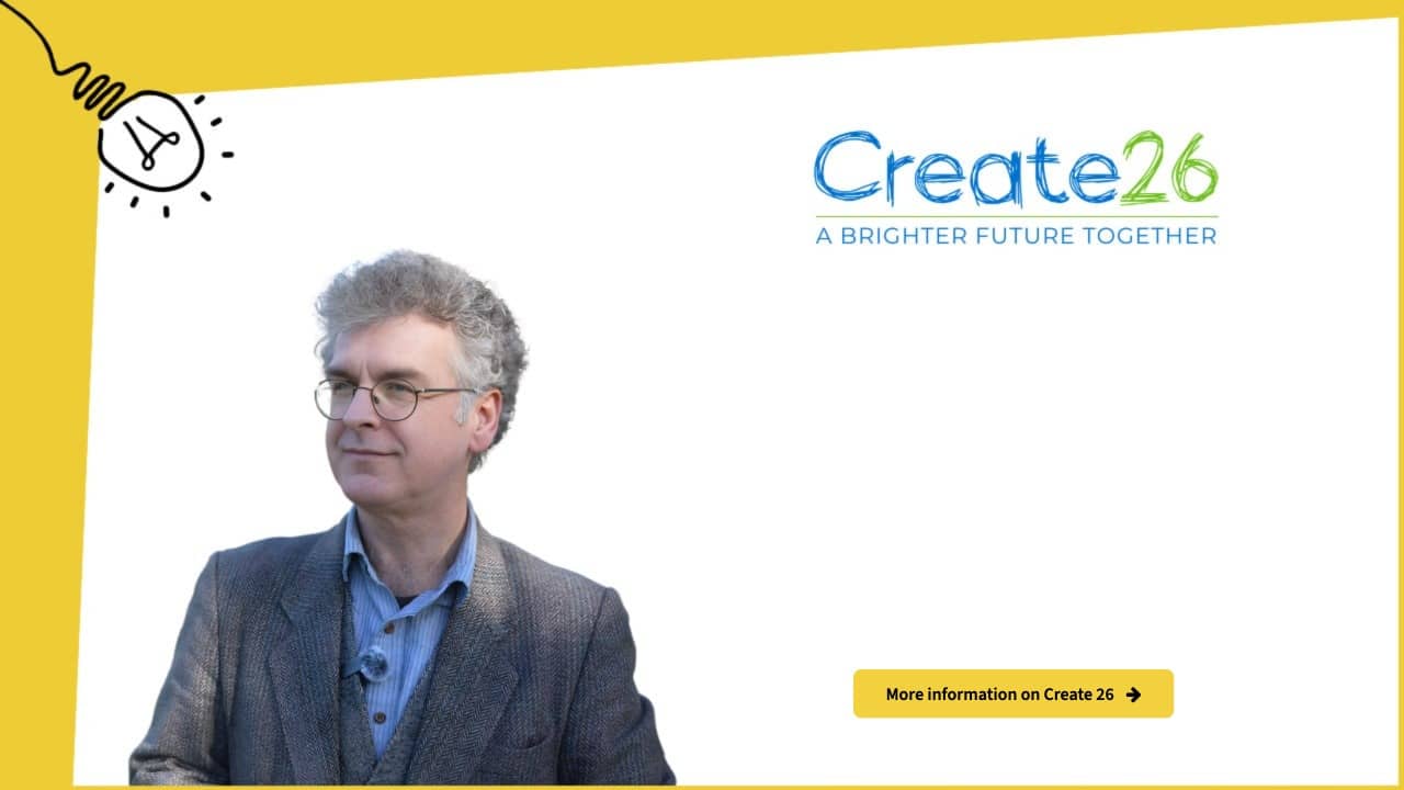 A man in glasses and a grey blazer stands in front of a white background with Create26: A Brighter Future Together written beside him, along with a yellow button labelled More information on Create 26.