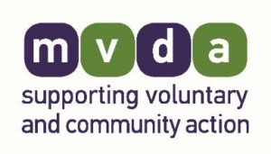Logo for MVDA. Four rounded squares with letters m, v, d, and a, alternating in dark purple and green. Below, the text reads: supporting voluntary and community action in Redcar and Cleveland.
