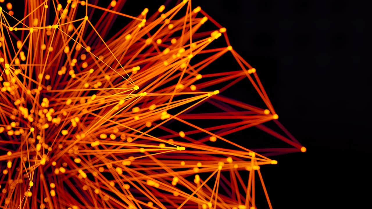 Abstract orange and yellow lines with glowing dots intersect and radiate from the left side, forming a dynamic, star-like web pattern against a black background.