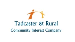 Logo for the Tadcaster Operations Manager and Rural Community Interest Company featuring an abstract graphic of two figures reaching towards each other.