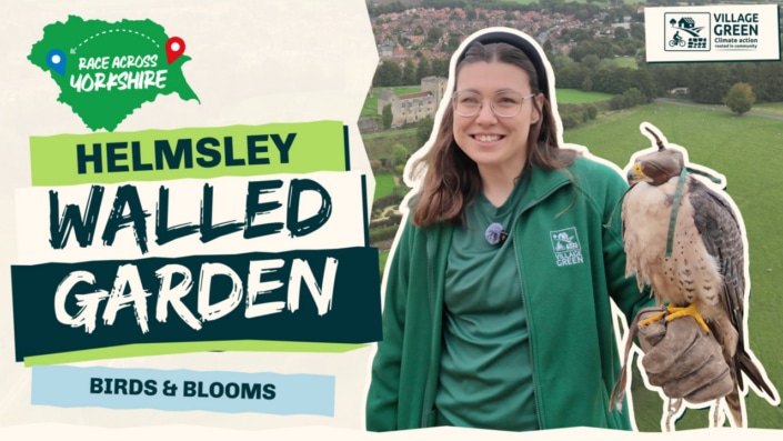 Ria holding a falcon at Helmsley Walled Garden, with Race Across Yorkshire campaign artwork.