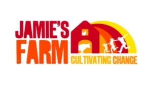 Logo for Jamie’s Farm, featuring the text next to a stylised barn icon containing a cow and chicken, with figures of children playing in front of a setting sun, representing the youth programme leader initiative.